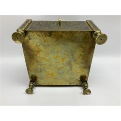 Late 19th century Damascus Cairoware Quran box, of square form with canted hinged cover, upon four circular pad feet, the brass exterior inlaid with silver and copper script and decorative detail, opening to reveal a marquetry lined interior, H15.5cm W19cm D19cm