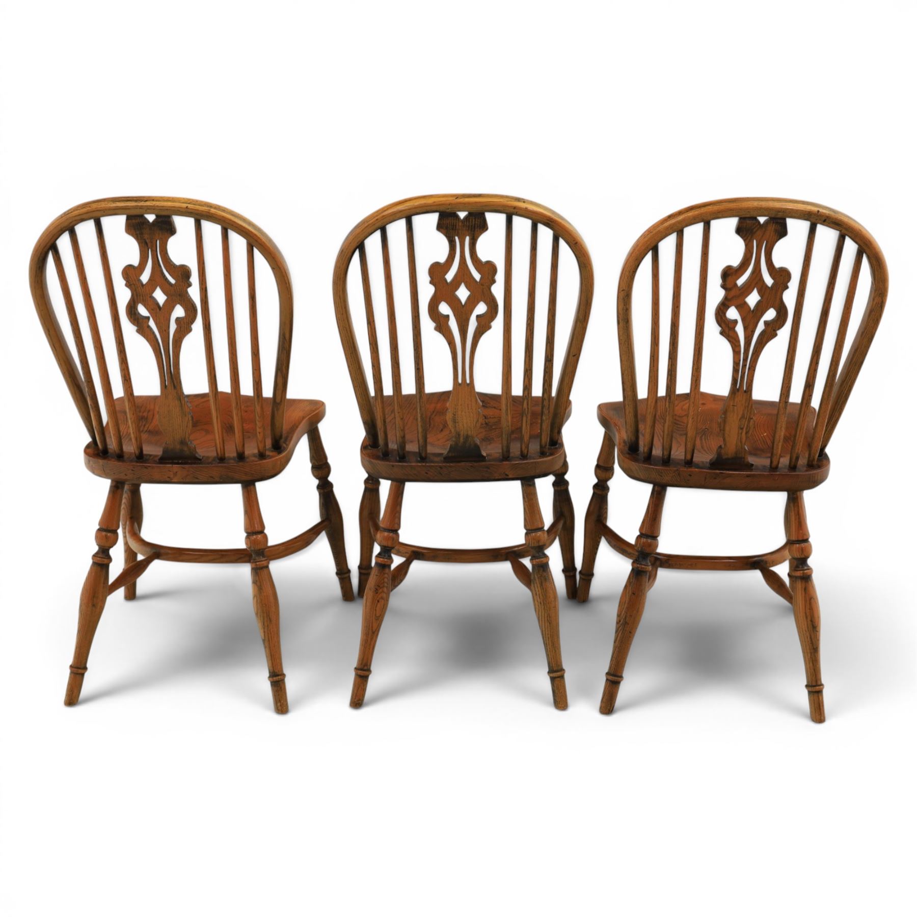 Set of six elm Windsor chairs, saddle seats with crinoline stretchers