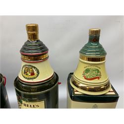 Six Bell's Old Scotch Whisky Christmas ceramic decanters comprising 1988, 1989, 1992, 1996, 1997 and 1998 all in original boxes and decanter seals intact 