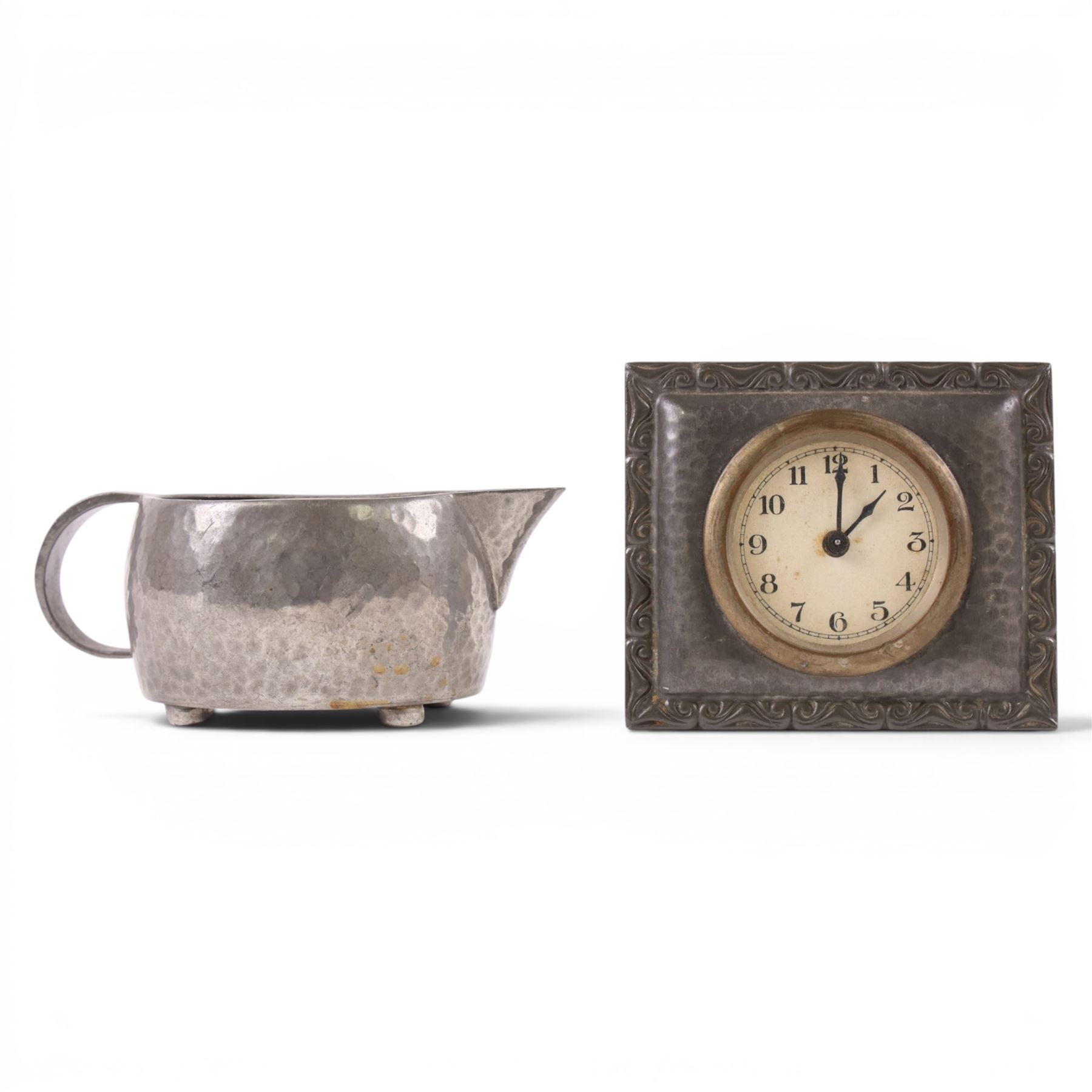 Tudric pewter part coffee set, coffee pot, hot water jug and milk jug, together with a Tudric pewter clock