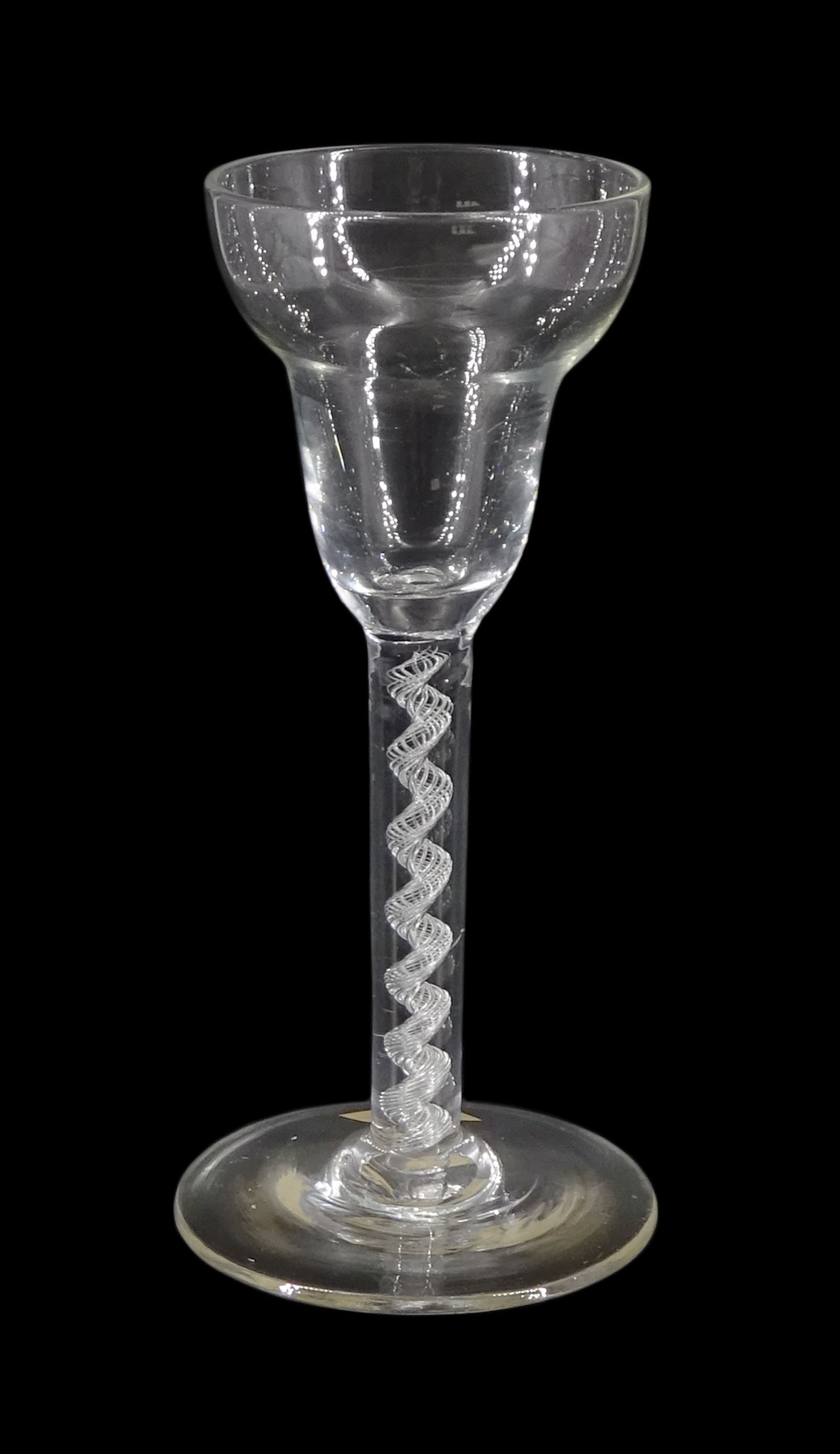18th century drinking glass, the pan-top bowl upon a single series air twist stem and conical foot, H15cm 