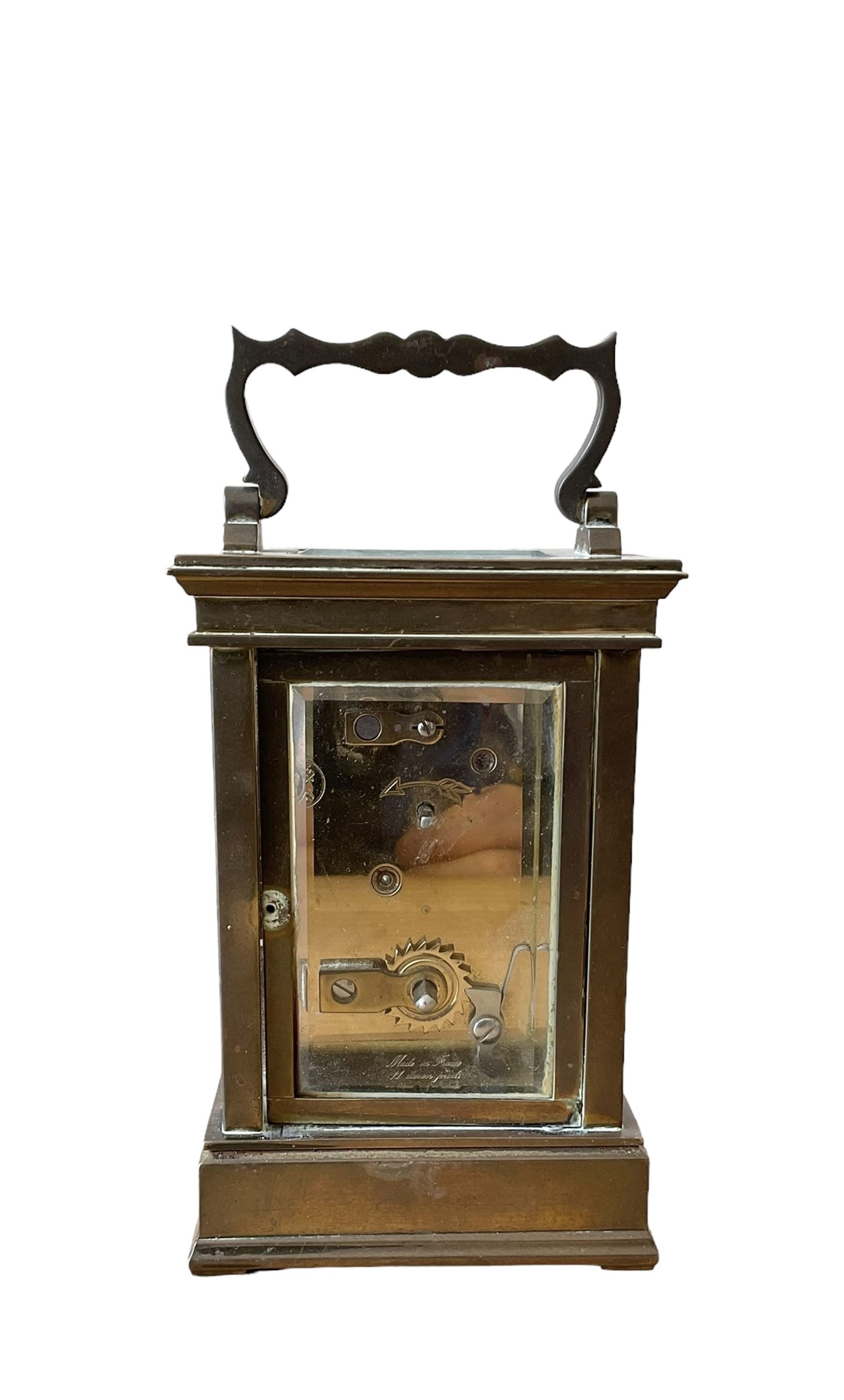 French -  brass cased 20th century  8-day timepiece carriage clock, dial inscribed L' Epee Fondee-En 1839, Sainte Suxanne, France, with a circular enamel dial and an embossed brass dial mask, Roman numerals, minute markers, five minute Arabic's and steel moon hands, with a jewelled lever platform escapement.