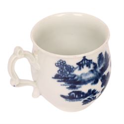 Worcester blue and white spoon tray, decorated in the Argument pattern, circa 1780-1785, L16cm, together with a Worcester blue and white bell shaped coffee cup with moulded scroll handle, decorated in the Man in the Pavilion pattern, circa 1760-1765, H6cm