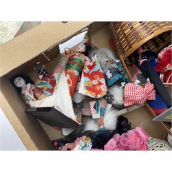 Large quantity of dolls to include oriental examples, native examples, knitted examples etc in four boxes