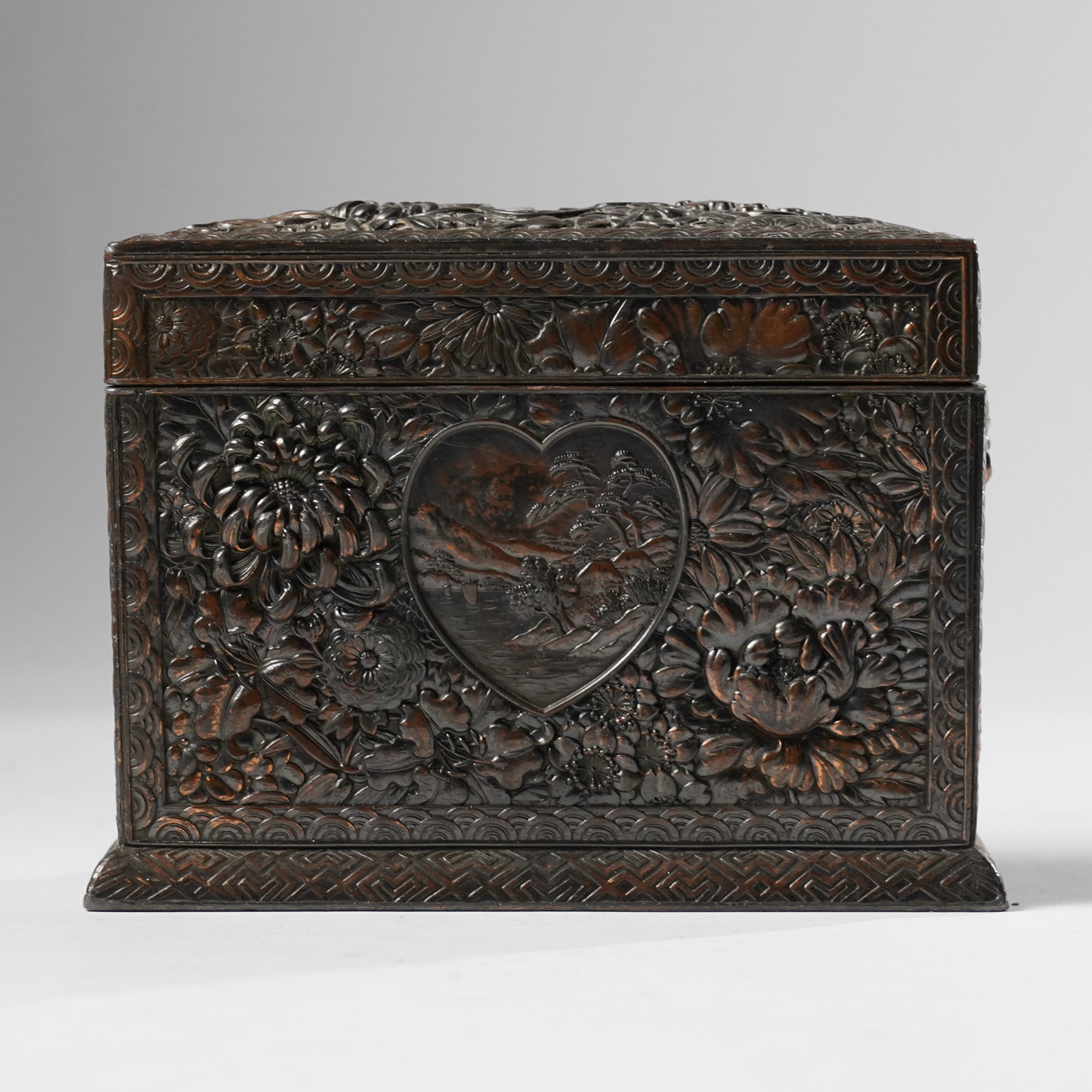 Japanese Meiji period bronze playing card box, decorated with intricate repoussé floral motifs, marked to base