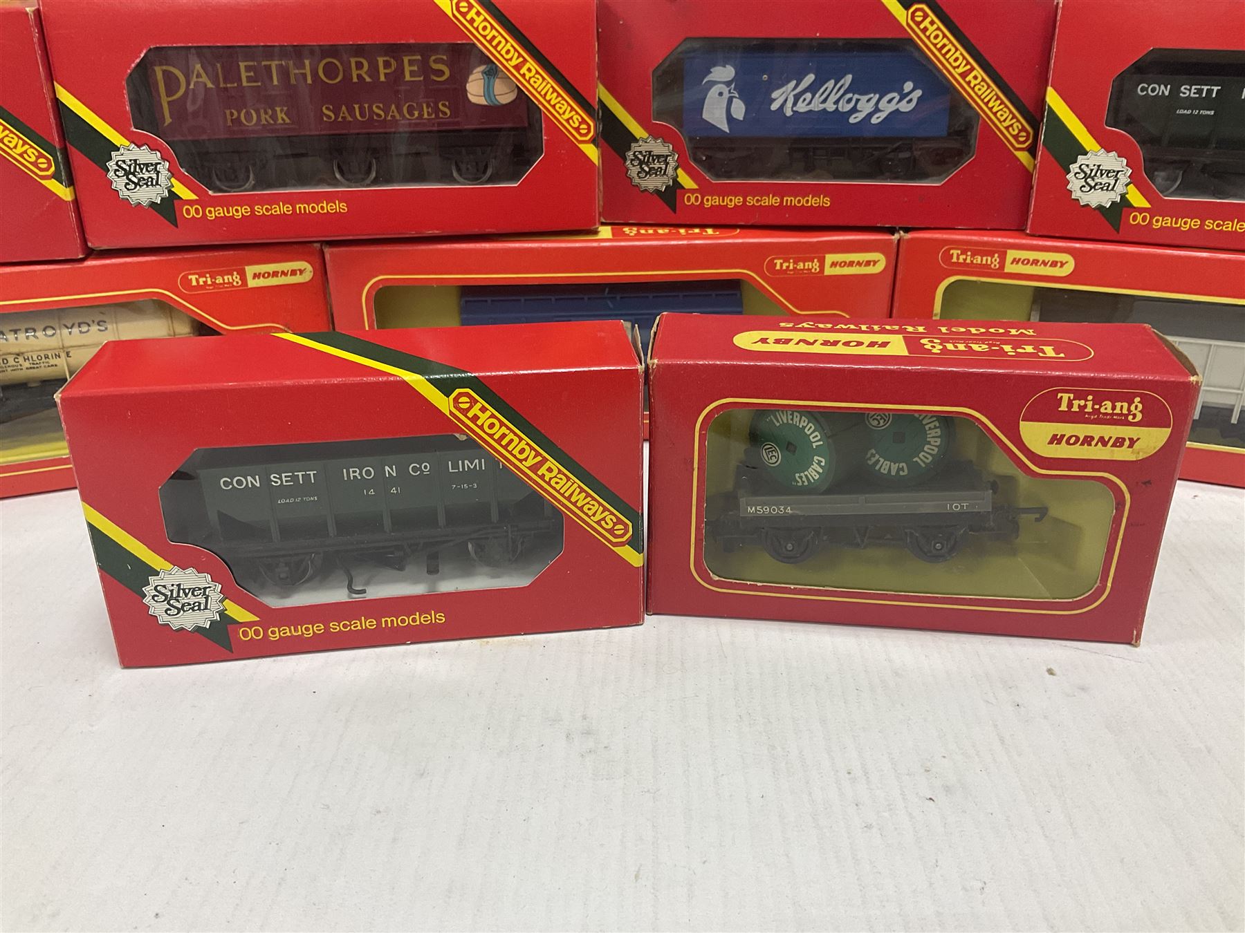 Hornby/Tri-Ang ‘00’ gauge - fifteen goods wagons to include freightliners with containers, ore wagons, closed vans etc; together with R404 Operating ore wagon set; all boxed (16) 