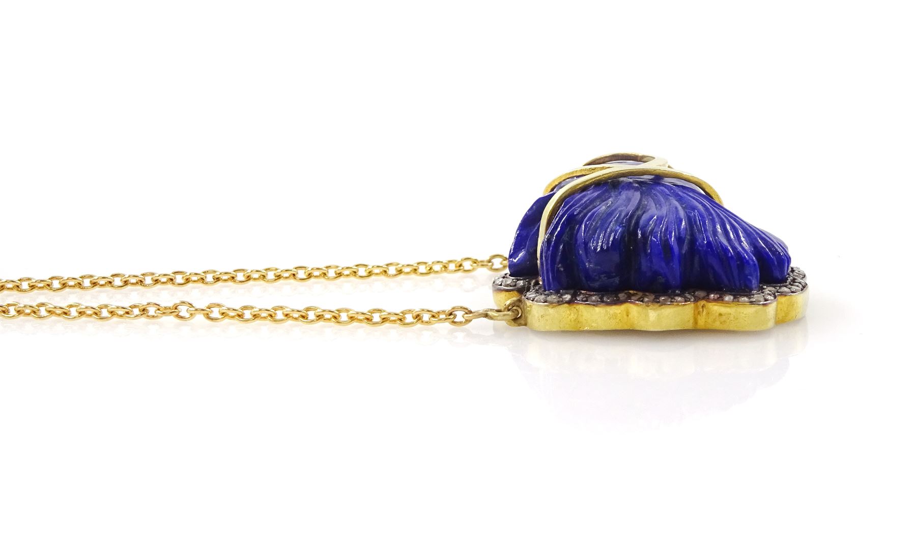 Silver-gilt lapiz lazuli and diamond horses head necklace, carved head with rose cut diamond surround, to a gilt fine link chain necklace, lapiz weight approx 46.20 carat, total diamond weight approx 0.50 carat