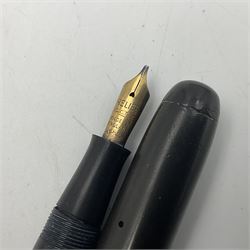 Four fountain pens, three with 14ct gold nibs and one 18ct gold plated