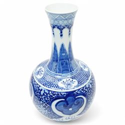 Late Qing Dynasty bottle vase decorated in blue and white with dragons and pearls, stylised leaves and flowers with key pattern foot H40cm 