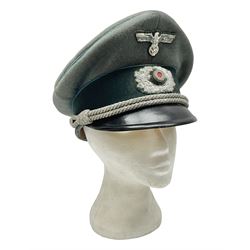 WW2 German Infantry Officer's visor cap with cloth insignia; labelled and stamped Offizier Kleiderkasse Berlin and Erel Stirnschutz