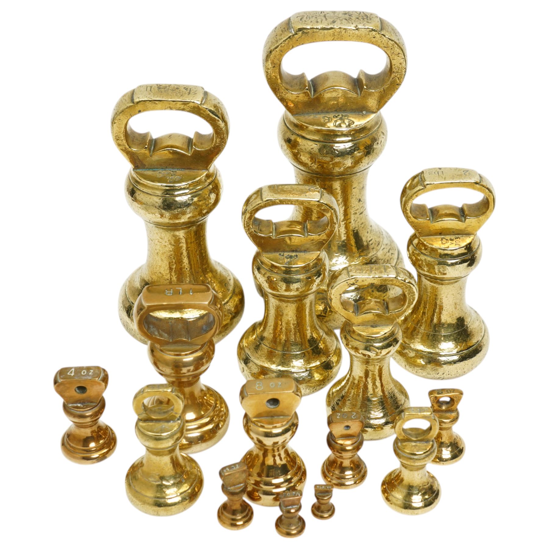 Group of fifteen brass bell weights 1/4oz-7ibs mostly Victorian, some marked with a sheep in a sling, possibly the mark for Holmfirth and a set of Libra scales with a set of graduated brass flat weights