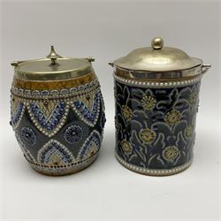 A 19th century Doulton Lambeth stoneware tobacco jar with a silver plate lid, rim and handle, the body with relief moulded foliate decoration, with impressed marks and monogrammed for W Baron beneath, H20cm, together with a further stoneware tobacco jar with silver plated lid, rim and handle, (unmarked), H20cm. 