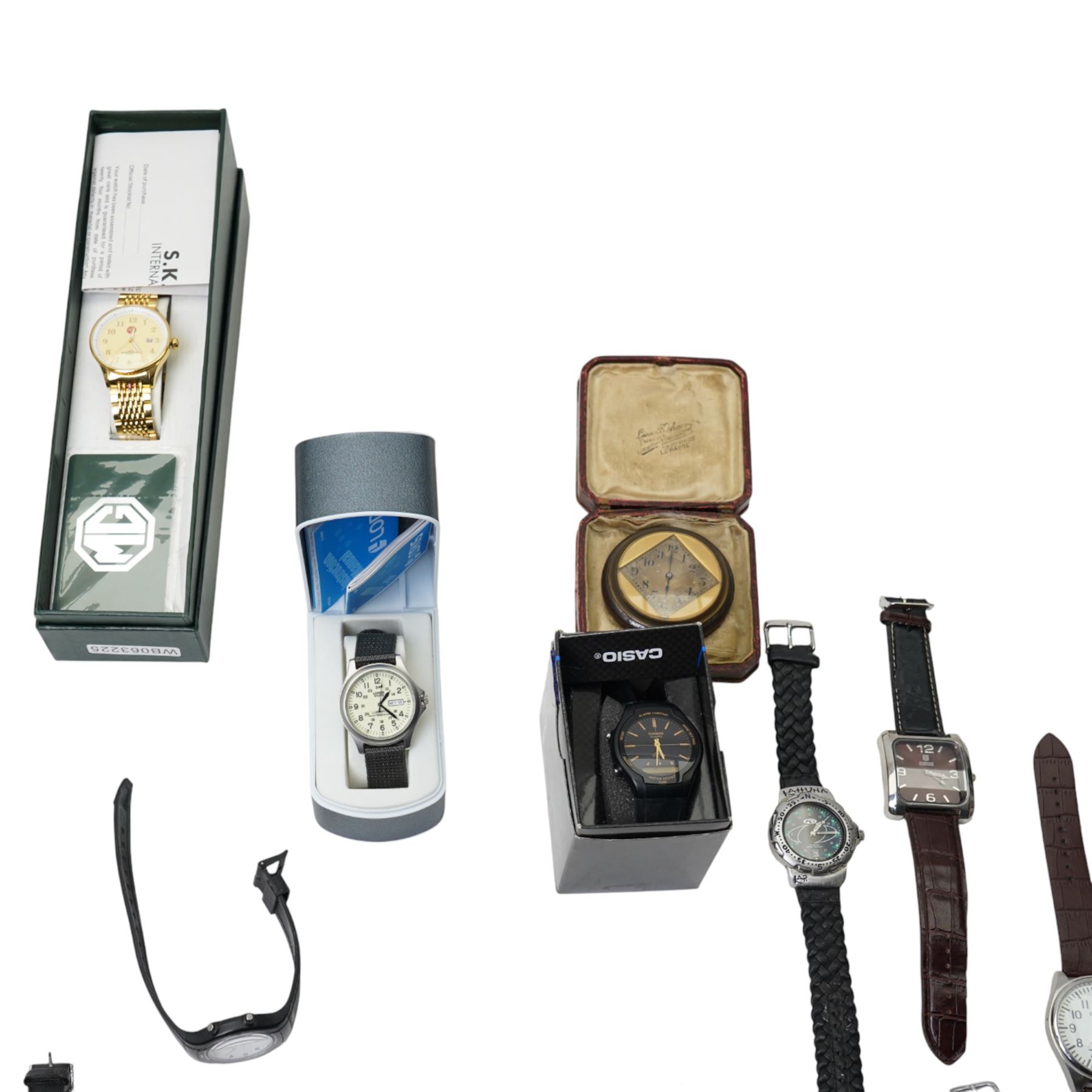 Collection of wristwatches including Casio and MG and an early 20th century gilt brass bedside timepiece, cased
