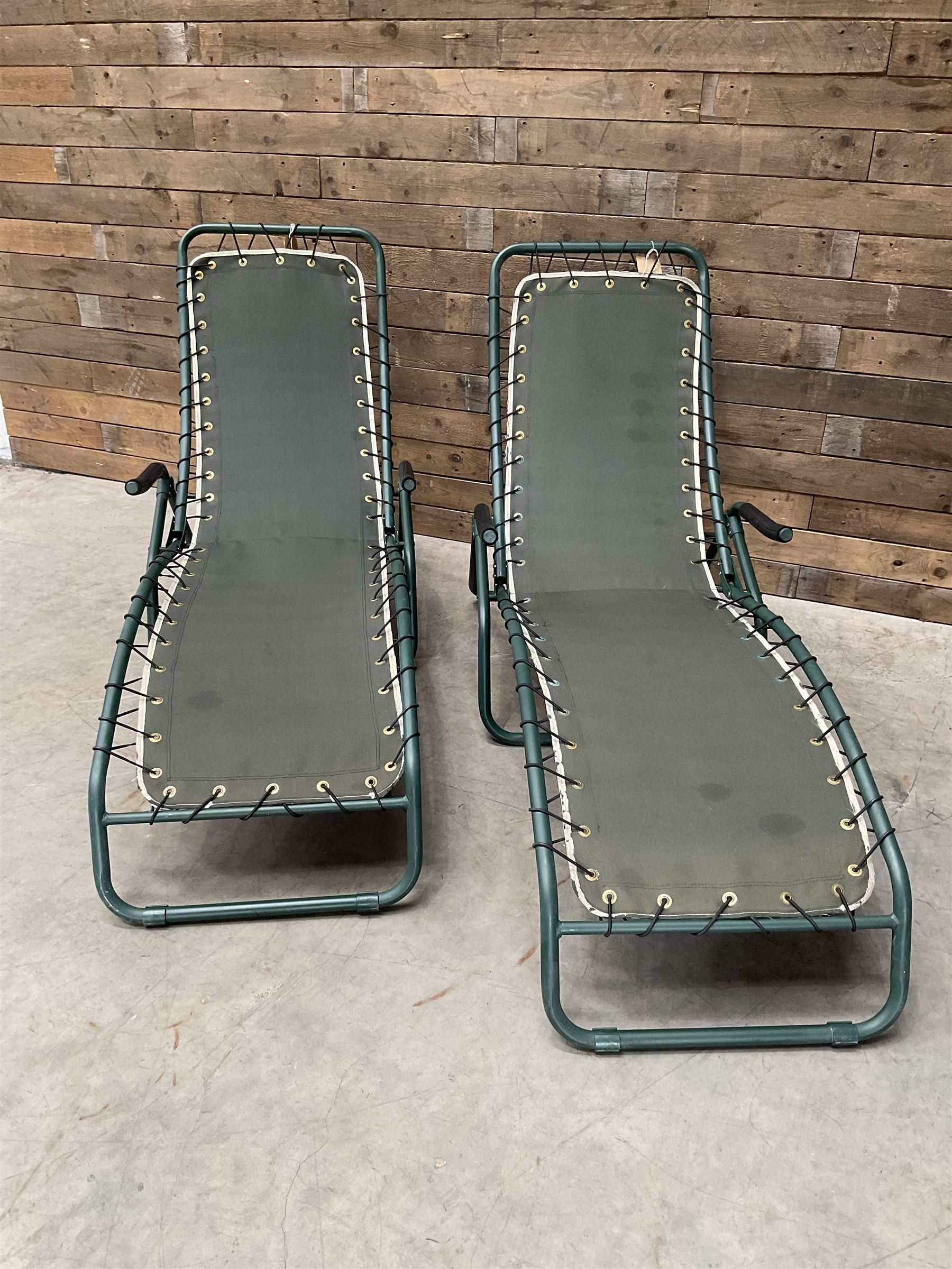 Pair metal framed folding sun loungers