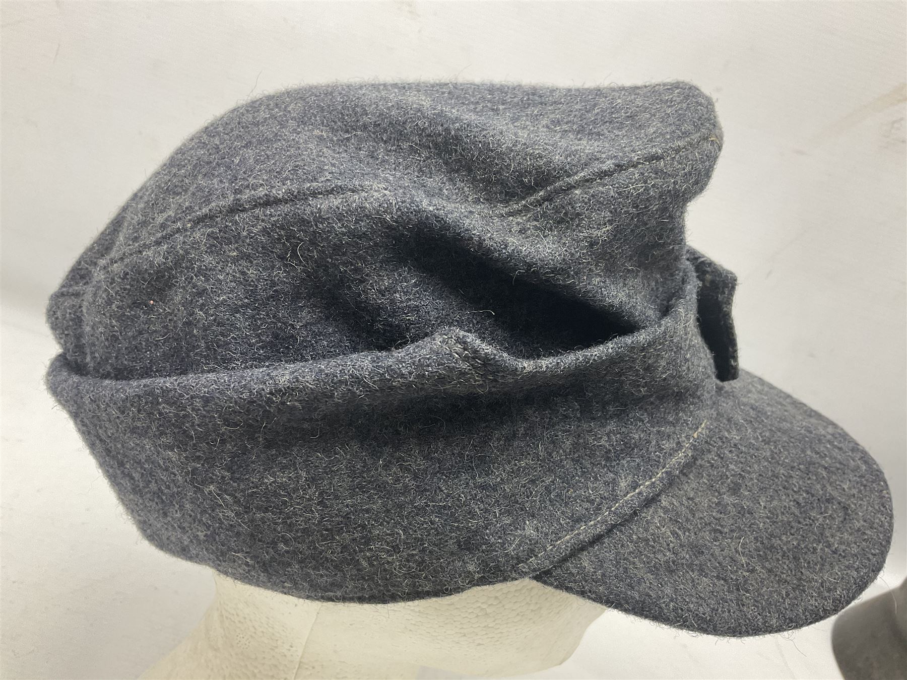WW2 German Luftwaffe M43 field cap with triangular cloth eagle and roundel badge; marked '1944 ?/0501/0015 57'