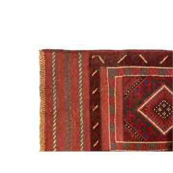 Turkish Kilim maroon ground runner rug, the field with four central lozenges surrounded by geometric borders