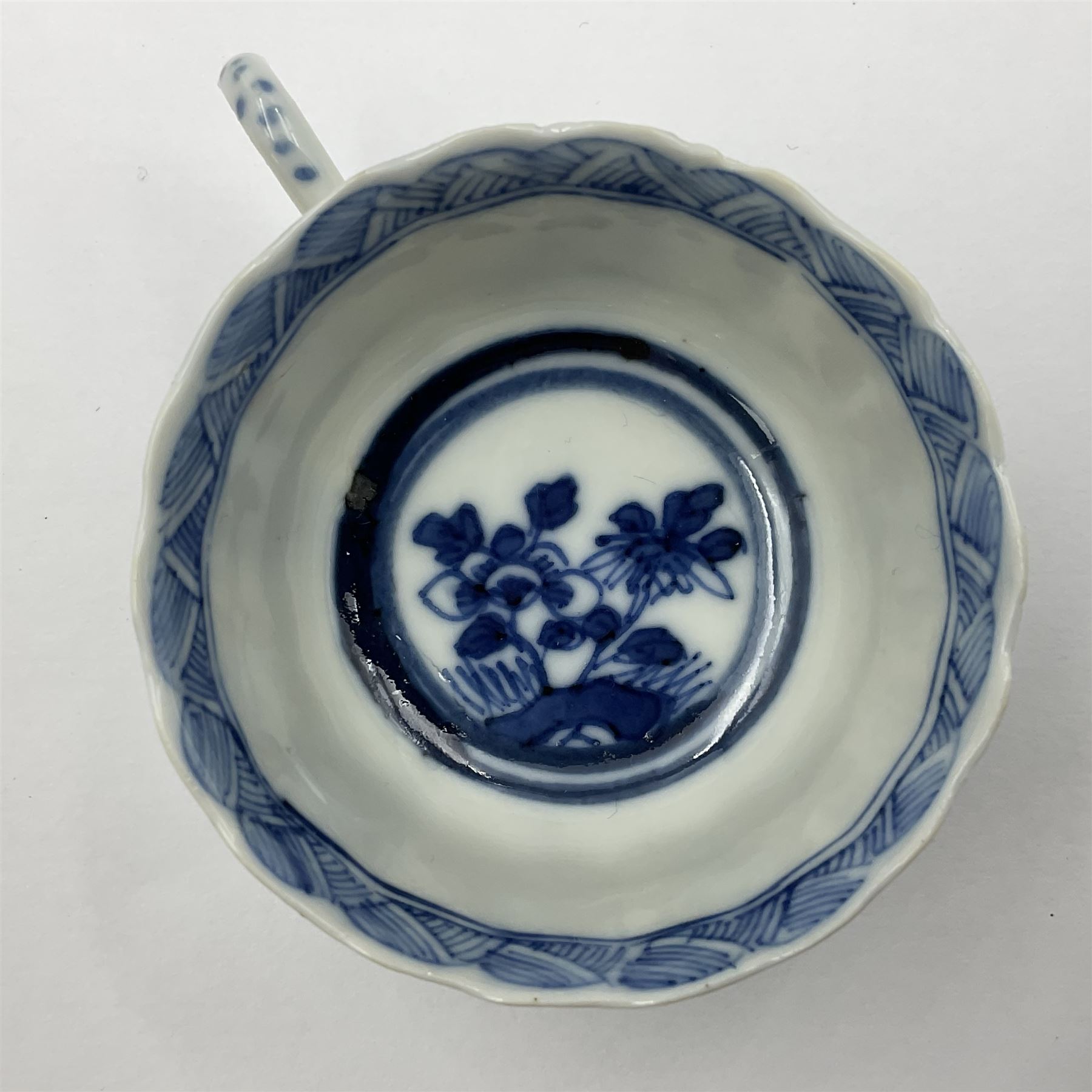 18th century Chinese blue and white Kangxi teacup and saucer, decorated with dancing figures, four character Kangxi mark beneath, saucer D10cm