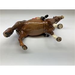 Beswick model of a huntswoman on grey horse model no 1730, and Beswick huntsman on brown horse model no 1501, both with printed mark beneath. 