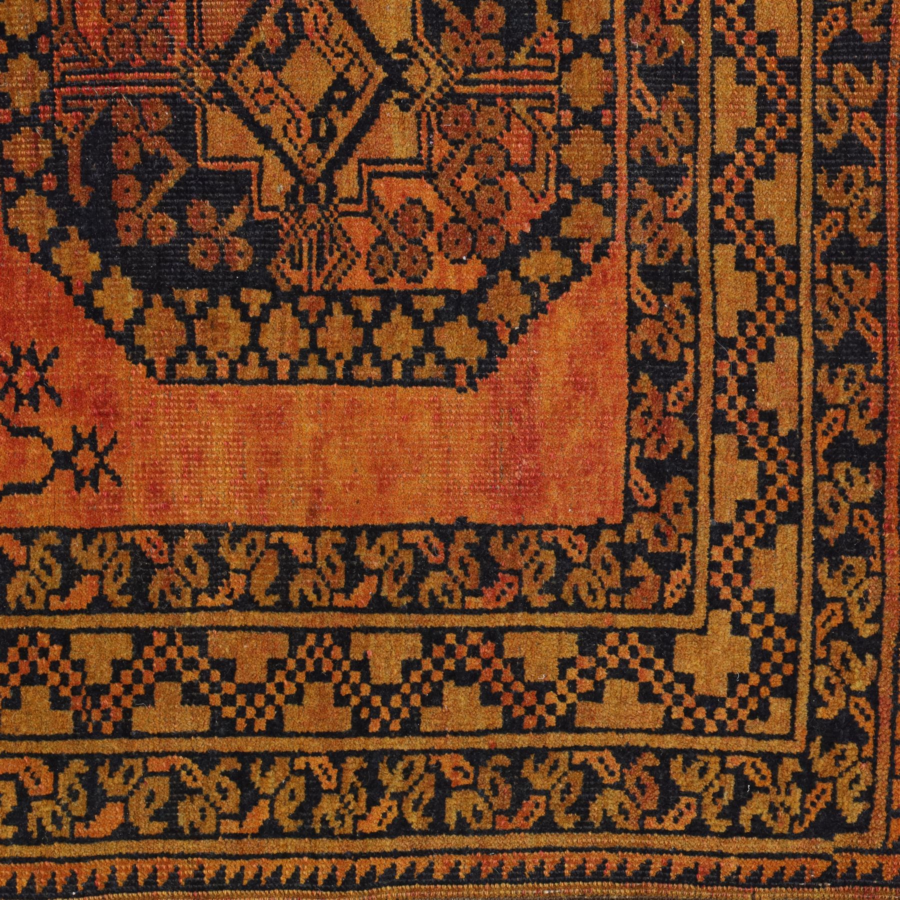 Afghan Ersari hand-knotted rug, apricot field decorated with three large octagonal gul medallions filled with geometric floral motifs, flanked by small tribal devices, end fringe fraying 97x167cm, together with a Baluch prayer rug, decorated with stylized tree motifs arranged in vertical rows beneath a stepped mihrab arch with multiple narrow borders of angular tribal motifs in shades of indigo, brown, and ochre fraying to flatweave ends, 134x84cm, (2)