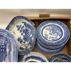 Collection of blue and white willow pattern dinnerwares, to include a covered tureen, two meat platters, dinner plates, dishes etc