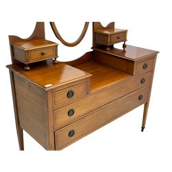 Edwardian inlaid mahogany dressing table, oval swing mirror, trinket drawers, above two small and two long drawers