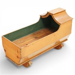 Victorian pine crib, of elongated rectangular form with raised hooded head end, painted in...