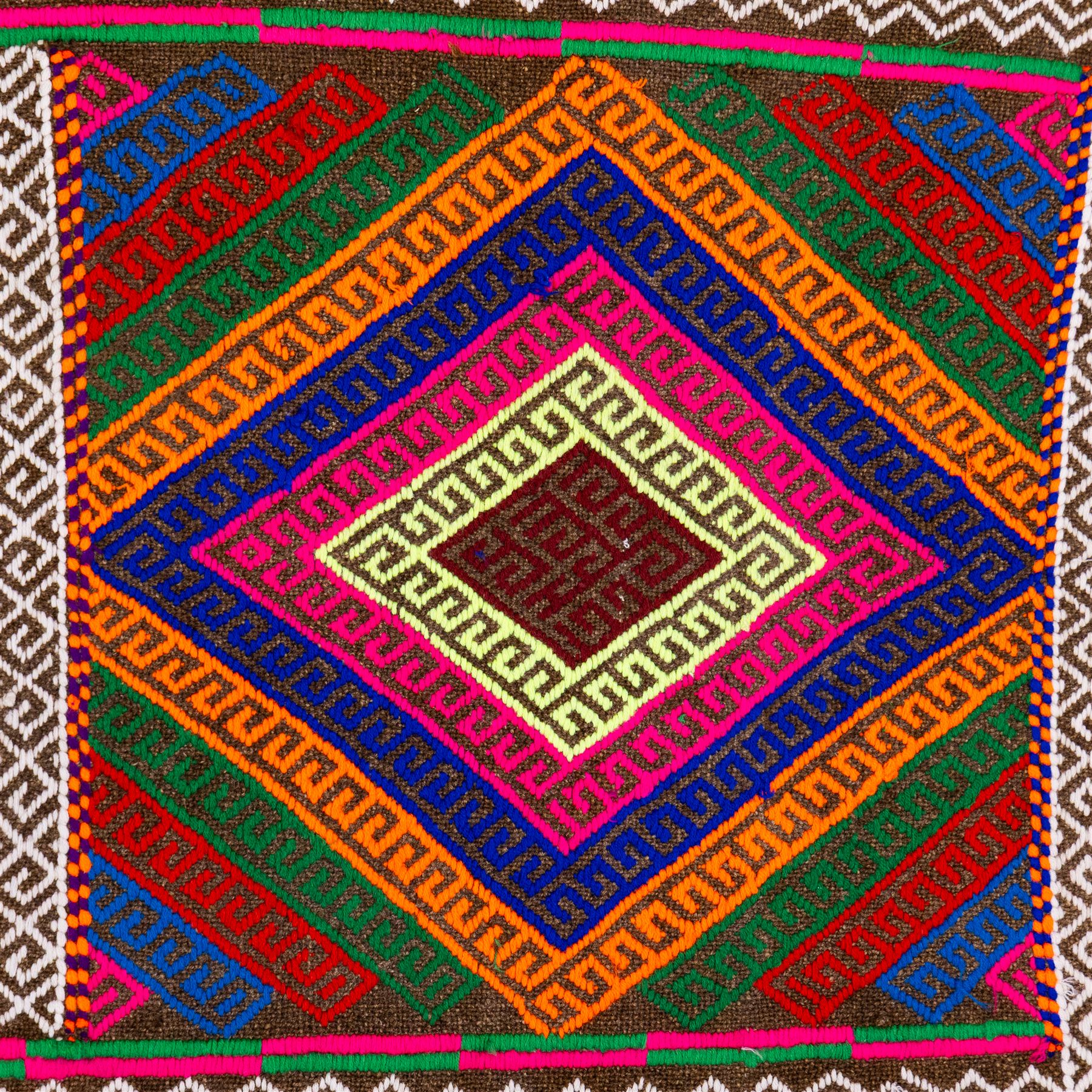 Afghan Suzni flatweave geometric design runner rug, decorated with trailing lozenges decorated with hooked motifs, within zig-zag bands, bright multi-coloured ground ivory and brown geometric main border