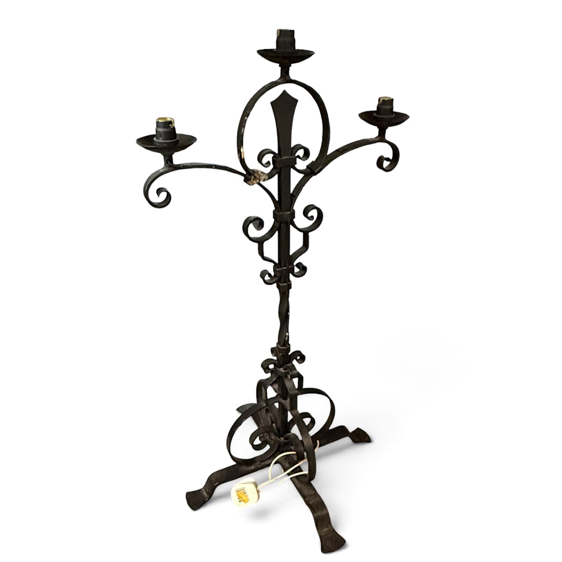 Collection of wrought iron candle stands, comprising five-light and three-light floor-standing candelabra with scrolling branches, and a pair of five-light table candelabra of naturalistic branching form
