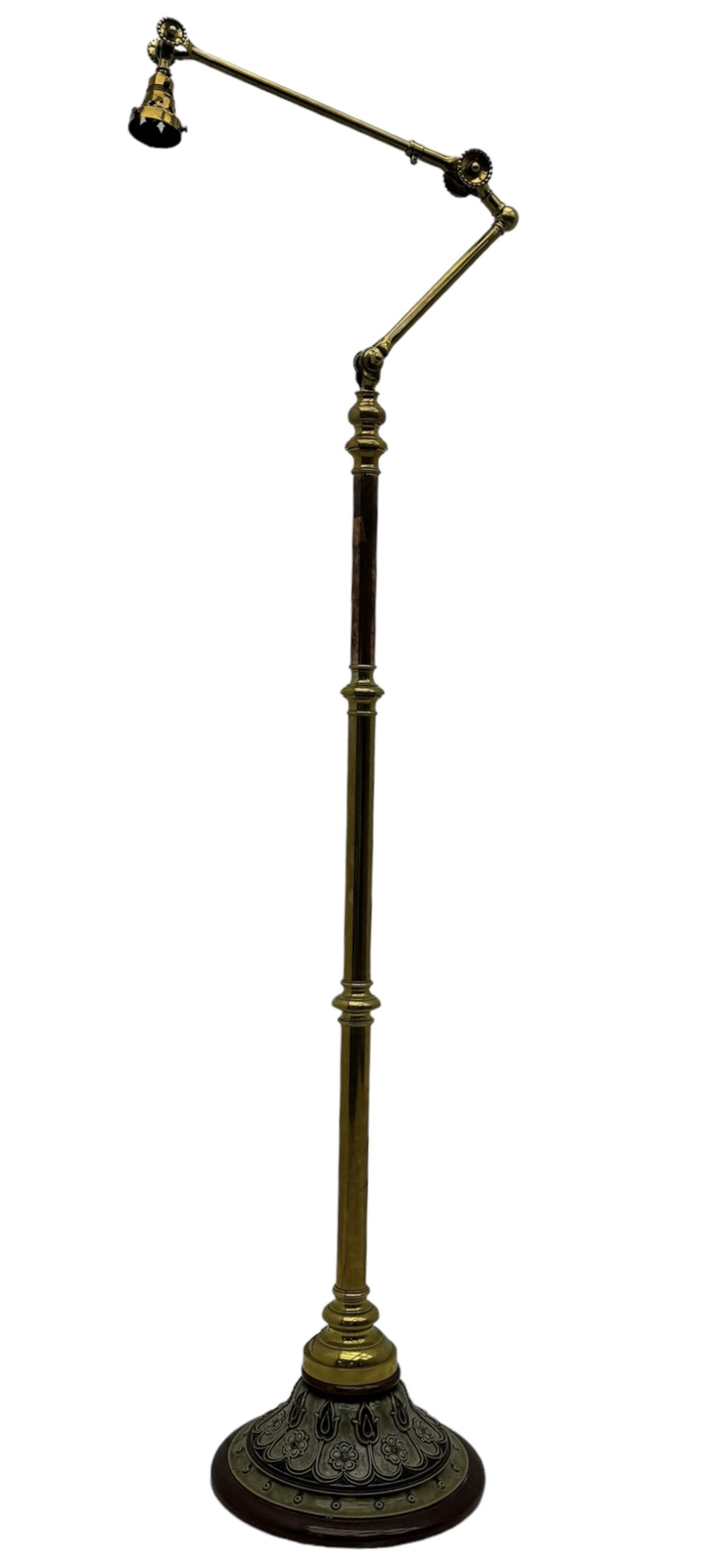 Early 20th century brass adjustable floor lamp, Royal Doulton decorative ceramic base embellished with raised floral and scroll patterns, stamped, brass column and adjustable arms terminating in brass bulb holder