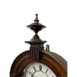 Lenzkirch – 8-day walnut cased weight driven Vienna regulator manufactured 1877-1878, with a break-arch pediment surmounted by a turned finial on a raised cavetto molding, fully glazed arched  door flanked by long ring turned pendants, flat base with open fretwork and two short pendants,  two piece enamel dial within a brass slip, Roman numerals, minute track and pierced steel hands, wooden pendulum with a brass faced bob, two brass cased weights and pulleys, dead beat escapement with a rack striking movement sounding the hours and half hours on a coiled gong, movement serial number 421410. 
Lenzkirch were one of Germanys most highly respected clock manufacturers of the 19th century, founded in the late 1850s the company produced movements and cases of high quality up until 1932.
