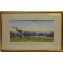  Cattle Grazing with Townscape in the Background, early 20th century watercolour signed by Arthur Varney 17cm x 35cm  