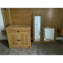 Light oak two door cabinet and two wall mirrors- LOT SUBJECT TO VAT ON THE HAMMER PRICE - To be collected by appointment from The Ambassador Hotel, 36-38 Esplanade, Scarborough YO11 2AY. ALL GOODS MUST BE REMOVED BY WEDNESDAY 15TH JUNE.