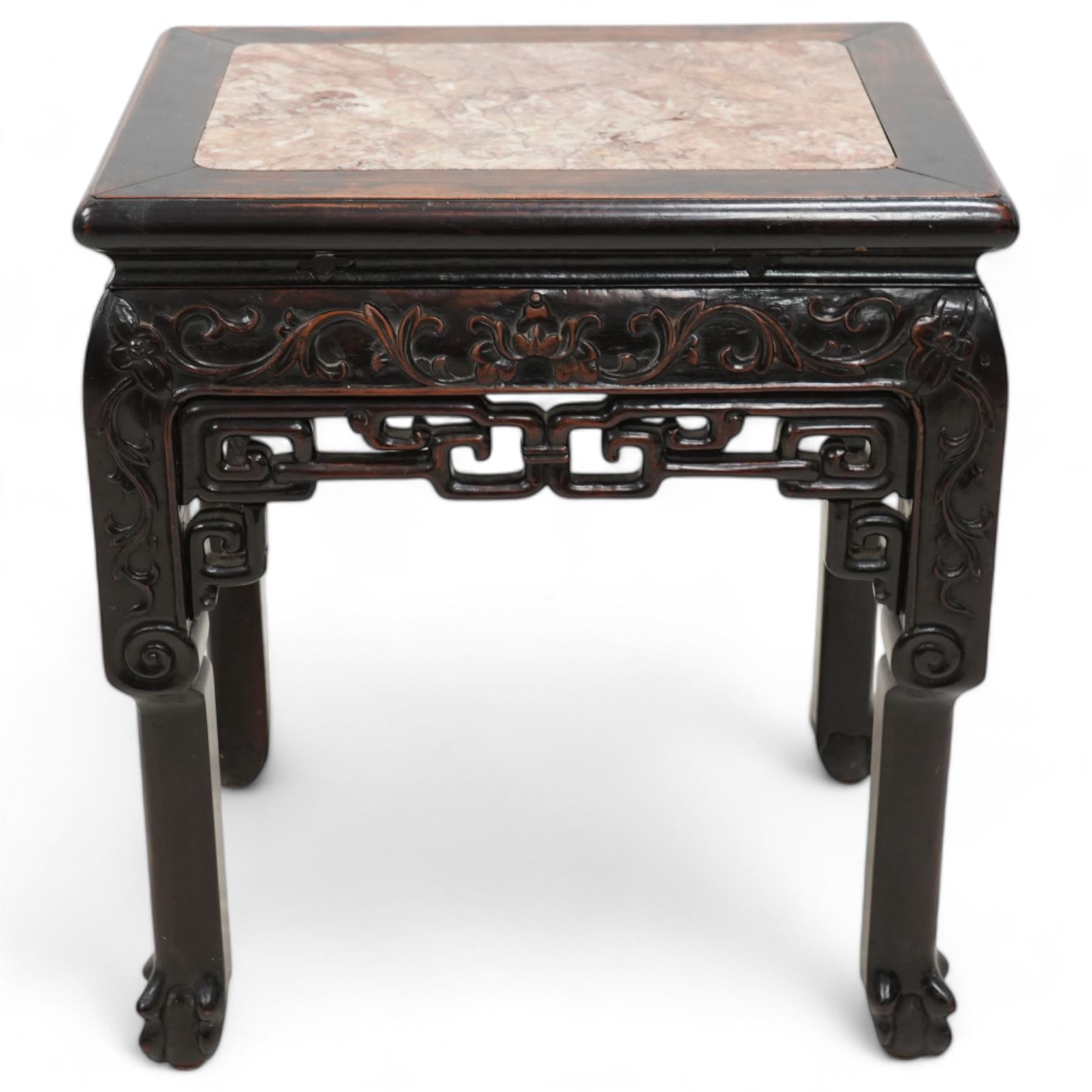Early 20th century Chinese carved hardwood and marble urn stand, rectangular moulded top with inset variegated rouge marble, carved with curling leafy branches and scrolls, shaped and pierced brackets, on ball and claw carved supports 