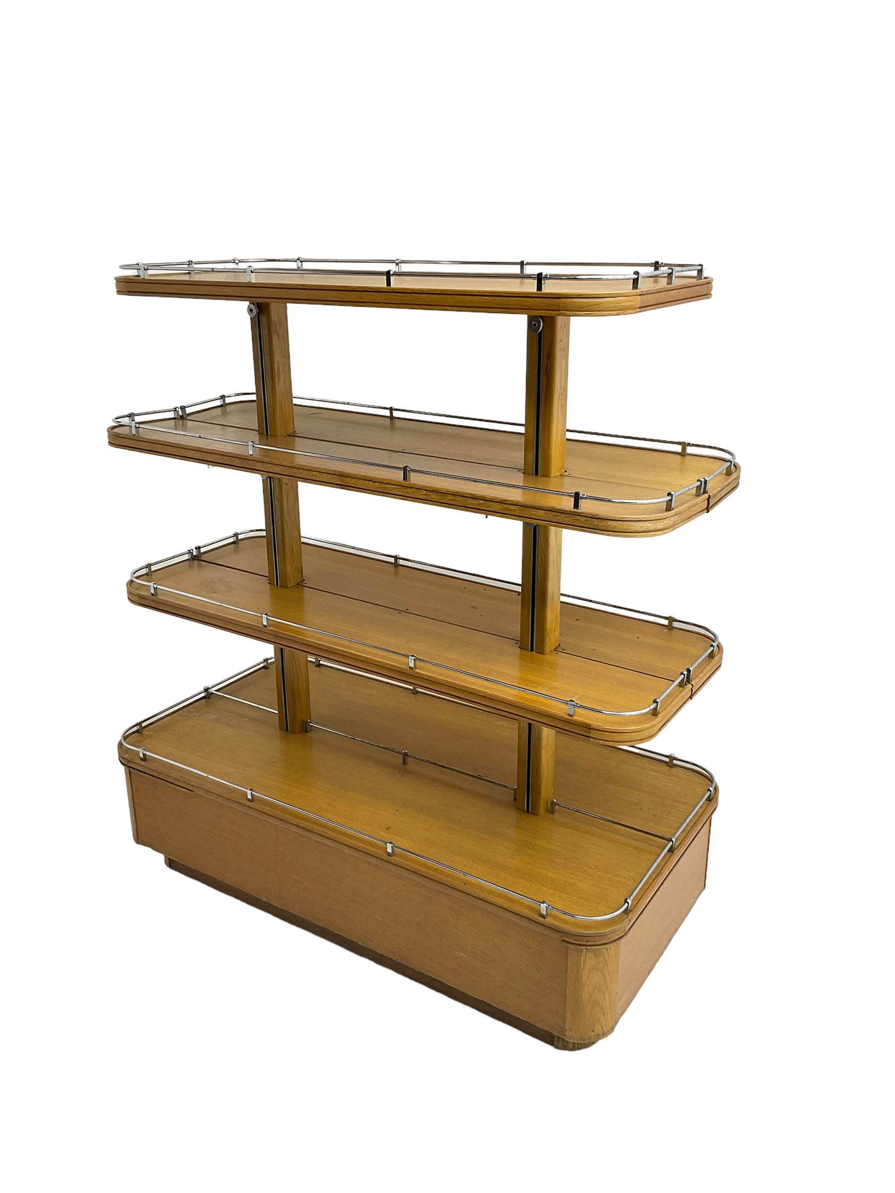 Early to mid-20th century Art Deco design oak shop display stand, fitted with four tiers, the middle two adjustable, with chrome gallery 