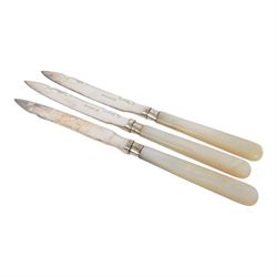 Set of six fruit knives and forks, with mother of pearl handles and silver collar, together with three silver plated toast racks, Askew twin handled tankard and two others   