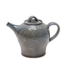 Gus Mableson - two studio pottery teapots, the larger example with a repeating floral pattern upon a brown ground, each with impressed makers marks below the handle, largest H18cm