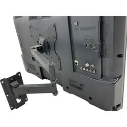 Panasonic 32 inch TV with DVD player and wall bracket and CD rack including various CDs 