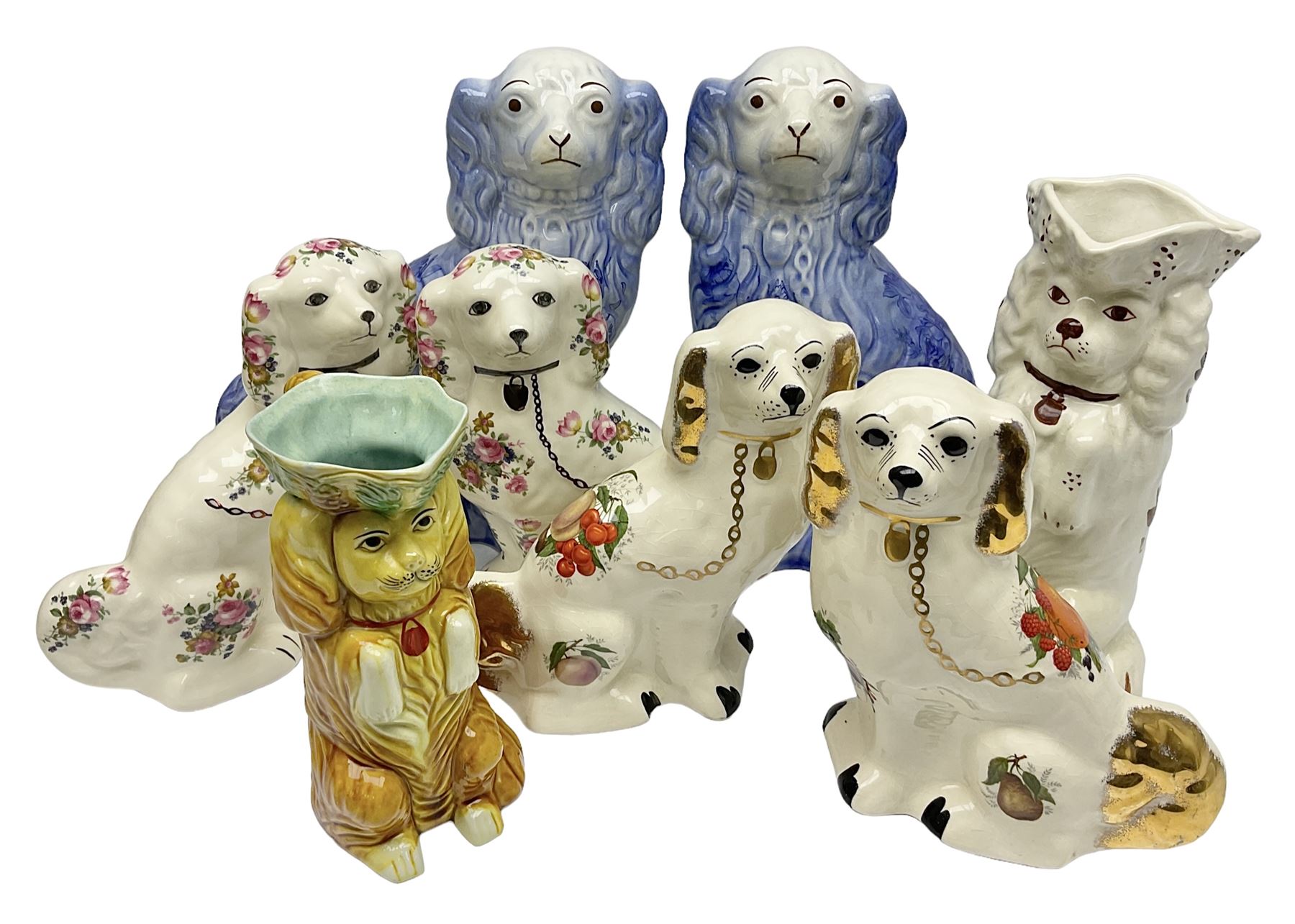 Three Pairs of Staffordshire style dogs, together with two Staffordshire style jugs, largest example H30cm 