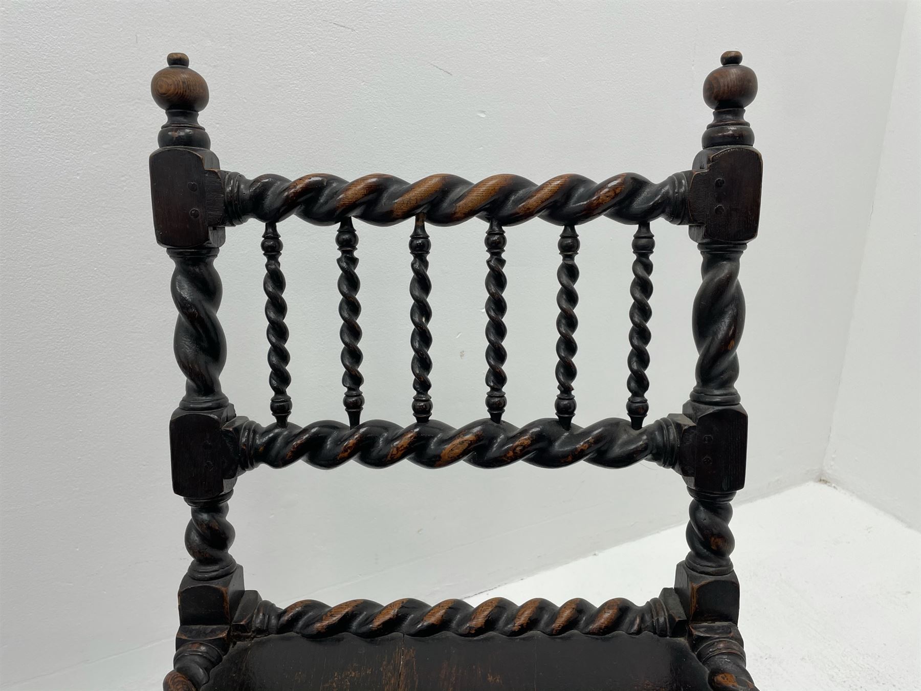 Unusual pair late 17th century oak spindle-back chairs, barley twist or spiral turned throughout, the back with a row of six vertical turned spindles, the supports joined by two lower rails and front central rail, plank seats

Provenance - The chairs illustrated in 'Early British Chairs and Seats 1500-1700' by Tobias Jellinek (Pub: Antique Collectors Club. 2009. p 313). Previous part of a private collection. Vendor purchased from auction 2014.

Measurements - seat width - 48cm, seat height - 38cm/36cm, depth - 50cm, total height - 85cm/82cm