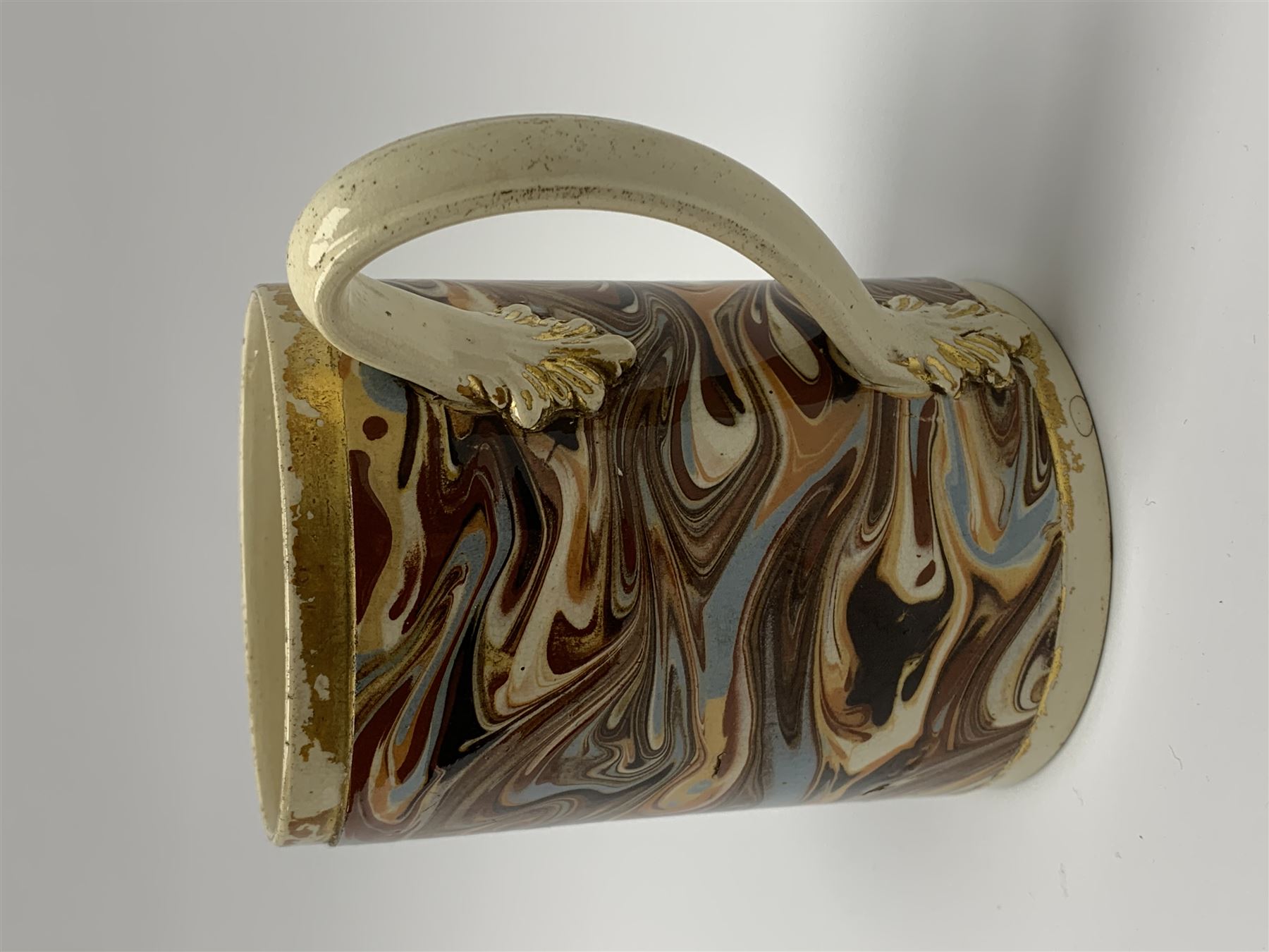 Late 18th century earthenware mug, possibly Ralph Wedgwood, Burslem or Ferrybridge, with surface marbled decoration and later gilt detail to rims and handle, impressed beneath Wedgwood & Co, H12cm