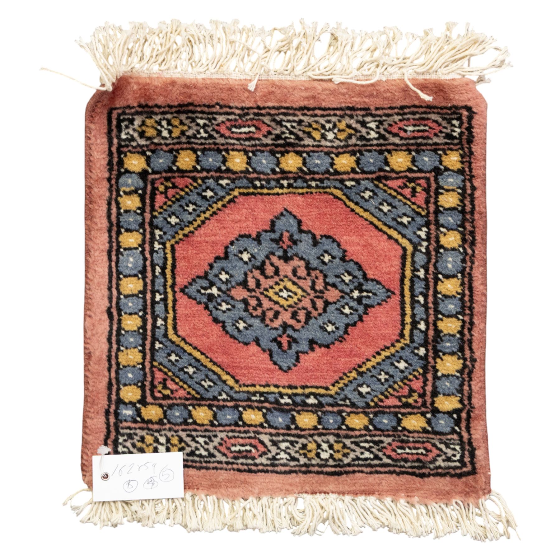 Long flatweave Kilim textile cushion, in crimson and decorated with geometric motifs and cotton fringe ends, 151cm, together with four modern hand-knotted rug mats with geometric designs, the largest 65x43cm, (5)