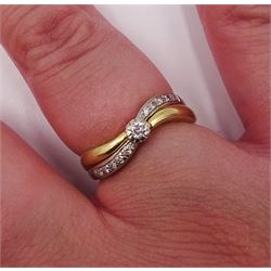 18ct white and yellow gold round brilliant cut diamond crossover ring, stamped 750