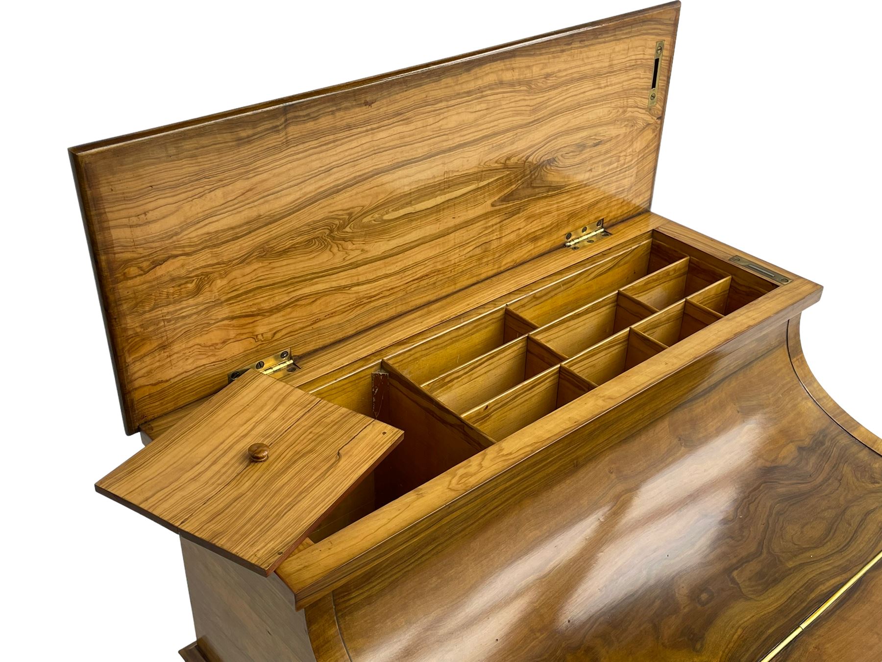 Fine and unusual 19th century olivewood piano top davenport, raised shaped back carved with olive branches and olives, the top hinges to reveal lidded and correspondence compartments, the piano lid enclosing sliding top with hinged and adjustable writing surface with leather inset, right-hand panelled door enclosing four drawers, olive branch and scroll carved cabriole front supports on moulded and shaped platform, turned cup feet with recessed castors 