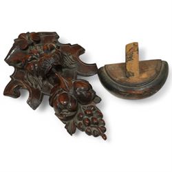 19th-century heavily carved oak baroque style cupboard with vine and floral carved frieze drawer above panelled cupboard door with floral carved appliqué (detached) flanked by symmetrically carved scroll and vine decorated sides, on bun feet 