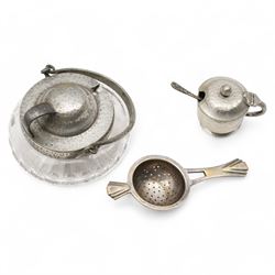 Three 18th century pewter serving spoons, with crown and London touch marks L22.5cm; Liberty & Co. Tudric Pewter sugar bowl; pewter salt and spoon; Cornish serpentine lighthouse; Vienna ceramic jug and Art Deco strainer (8)