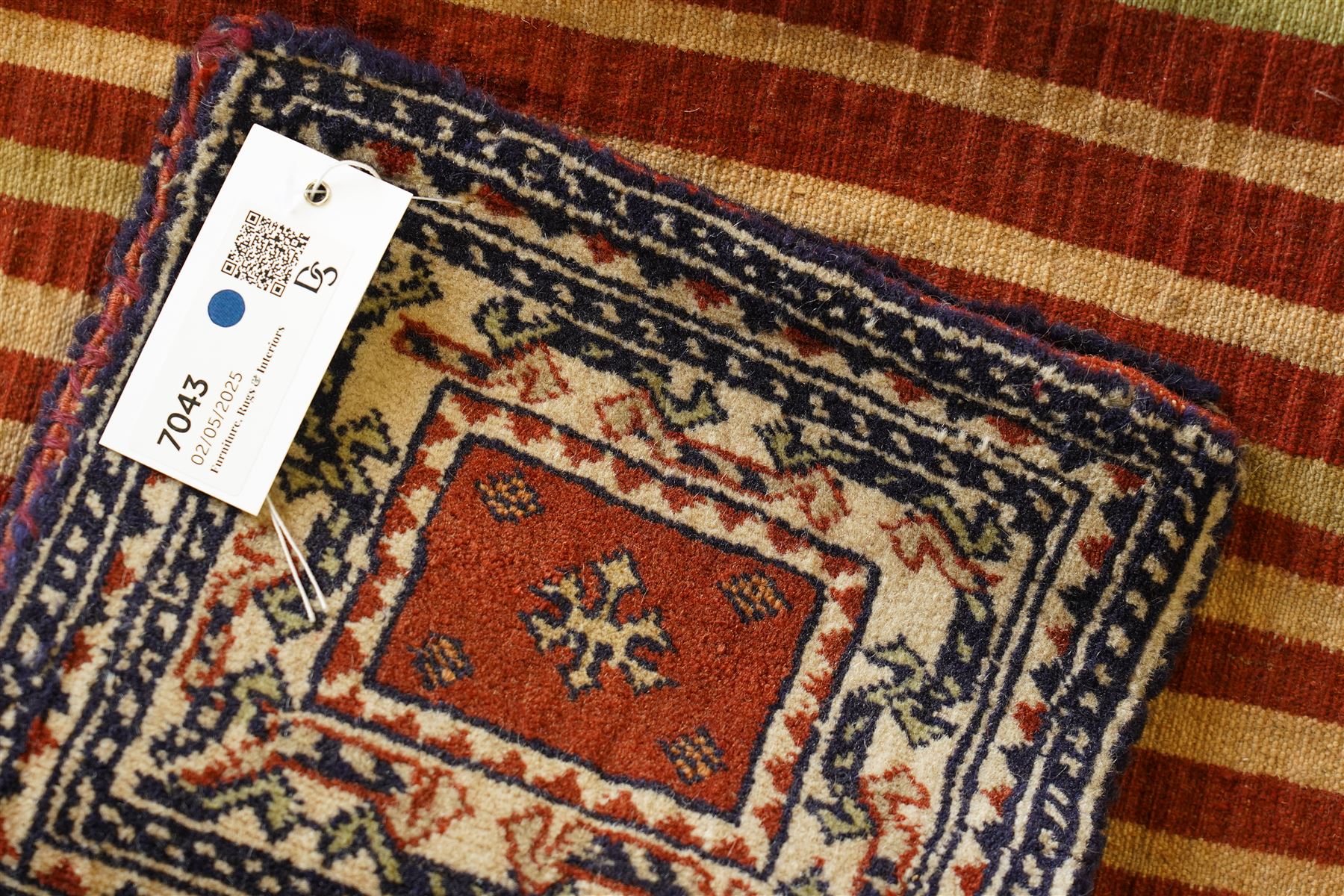Persian tribal khorjin (saddlebag face), repeating gul motifs on a terracotta background, within cream and navy stepped borders, Top flap double-sided panel
