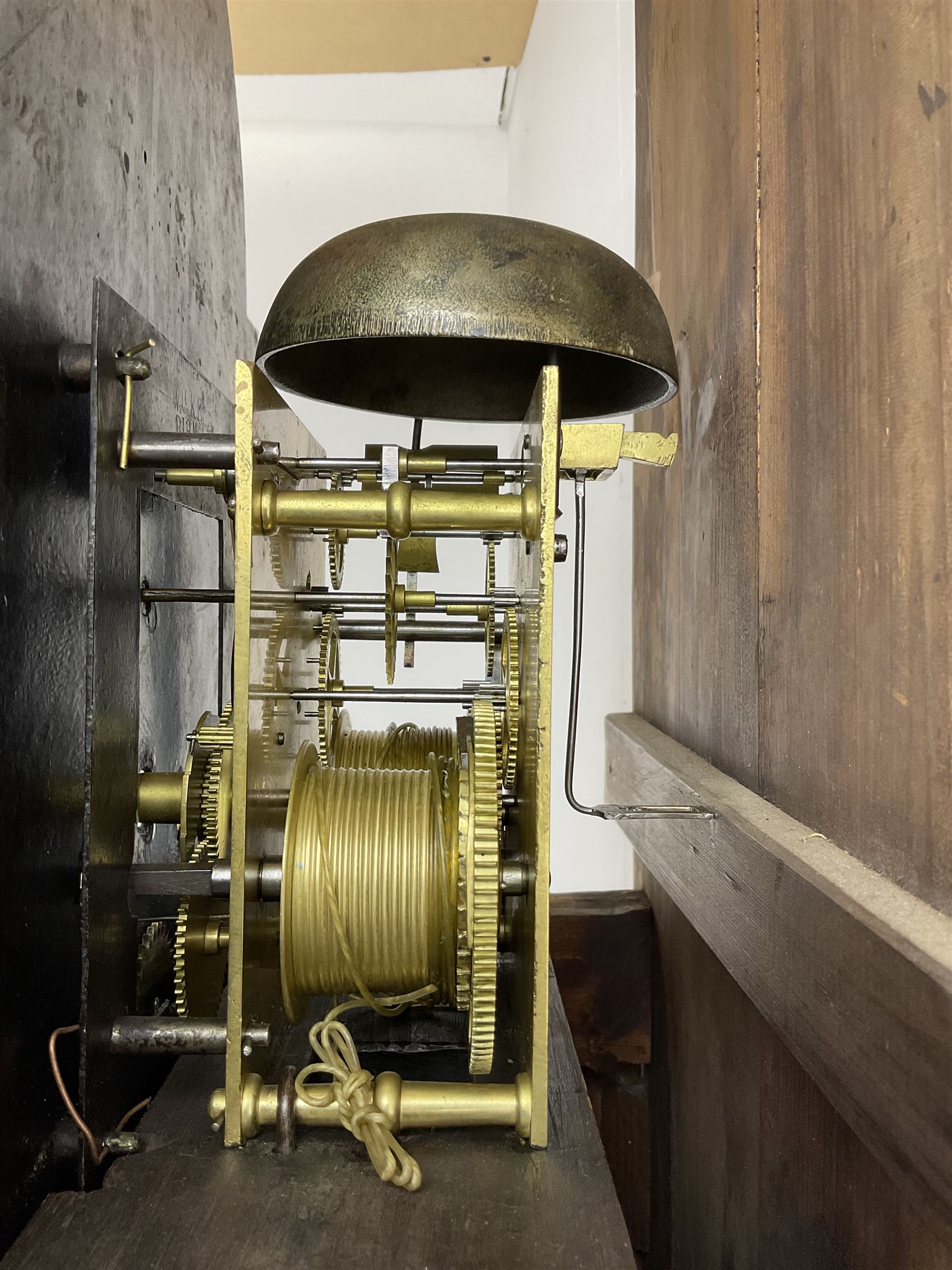 Thomas Gibson of Berwick - oak and mahogany 8-day longcase clock c 1860, with a flat topped pediment and recessed break arch door beneath, free standing pilasters with brass capitals, trunk with quarter columns to the corners and a wavy topped door, on a rectangular oak plinth with a shaped base,  painted dial with floral spandrels and a sporting scene to the break arch, Roman numerals, minute track and subsidiary seconds and date dial's, matching stamped brass hands pinned via a false plate to a rack striking movement, striking the hours on a bell. With weights, pendulum and key.   