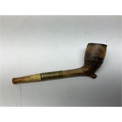 Carved meerschaum and amber pipe with silver mount, the bowl carved as a woman, cased, clay pipe in the form of an acorn, ceramic pipe, five other pipes and a ceramic bottle pourer in the form of a horse  