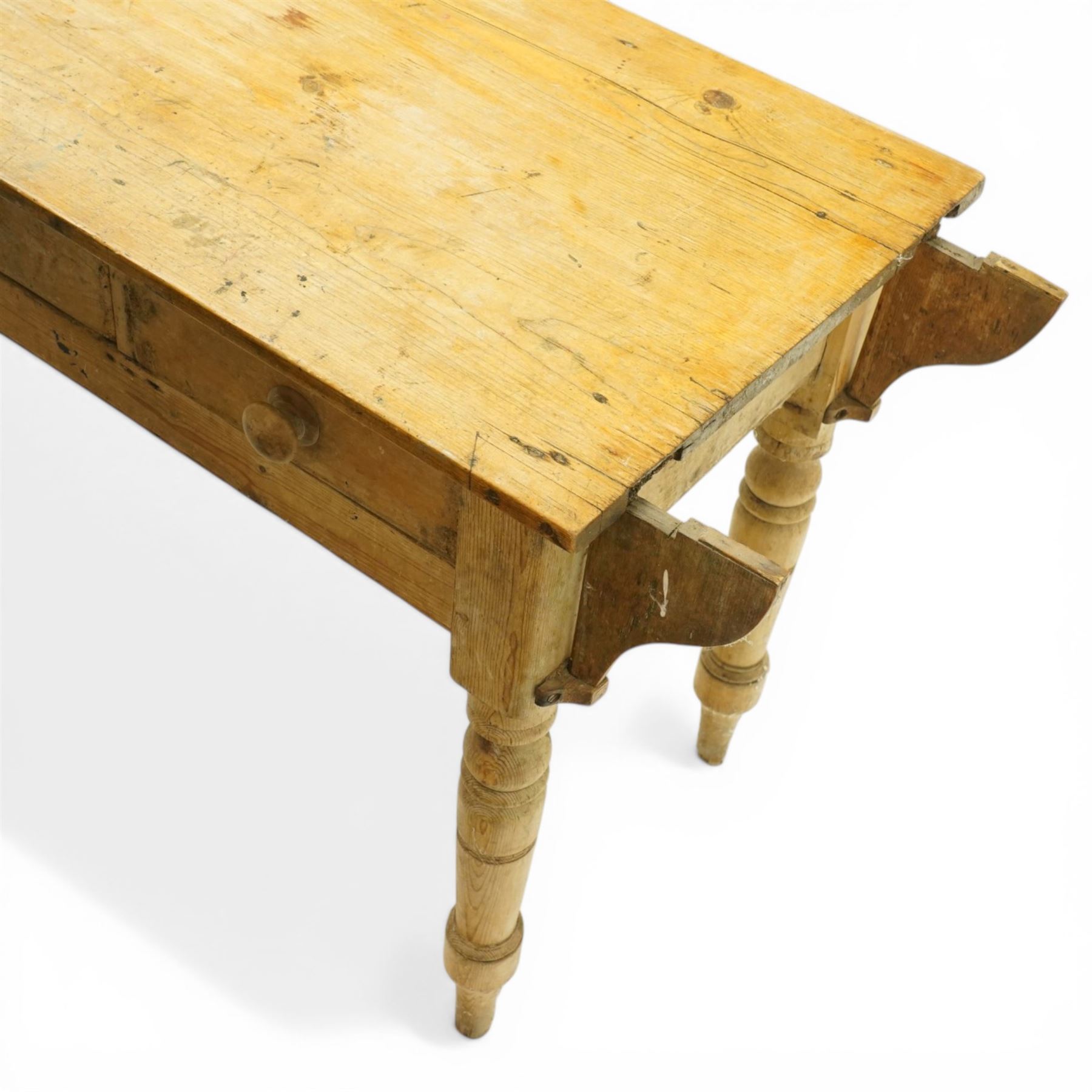 Victorian stripped pine table fitted with two drawers, supported on turned supports