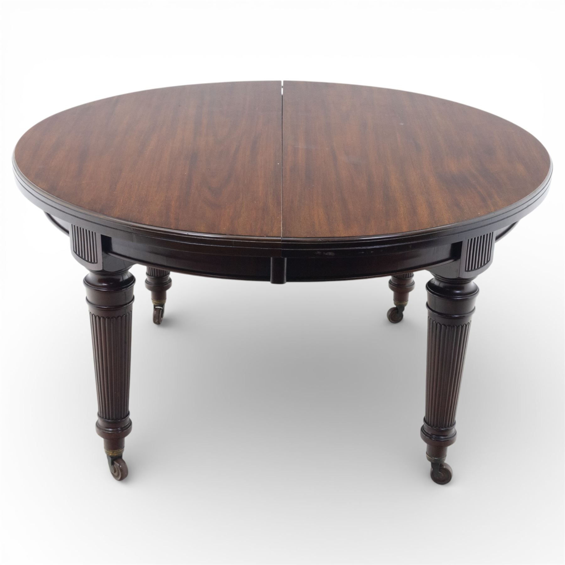Spillman & Co. London - large Victorian mahogany extending dining table with three additional leaves, upon turned and reeded supports with ceramic castors, bearing ivorine label beneath detailed 'Spillman & Co. St. Martins Lane, London', extends to 302cm